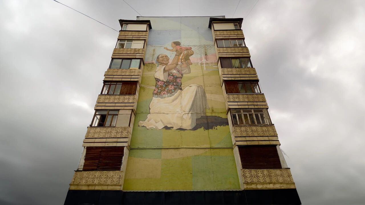 A mural photographed on a residential building by Tolegen Tolegenov